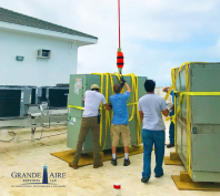 Crane lifting HVAC unit